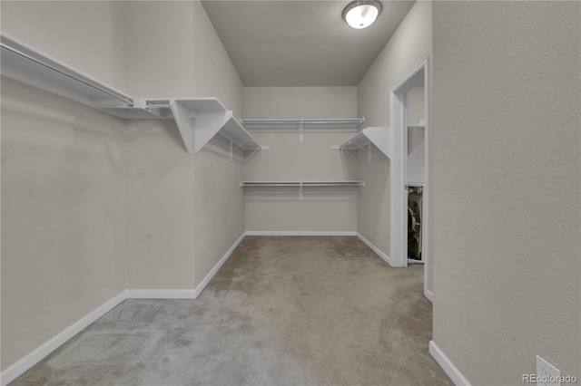 9476 Juniper Way, Arvada, CO 80007 - spacious closet featuring carpet flooring