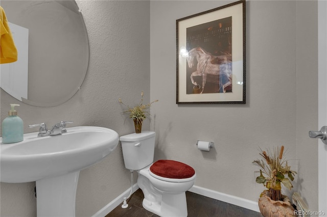 9476 Juniper Way, Arvada, CO 80007 - bathroom with baseboards and wood finished floors