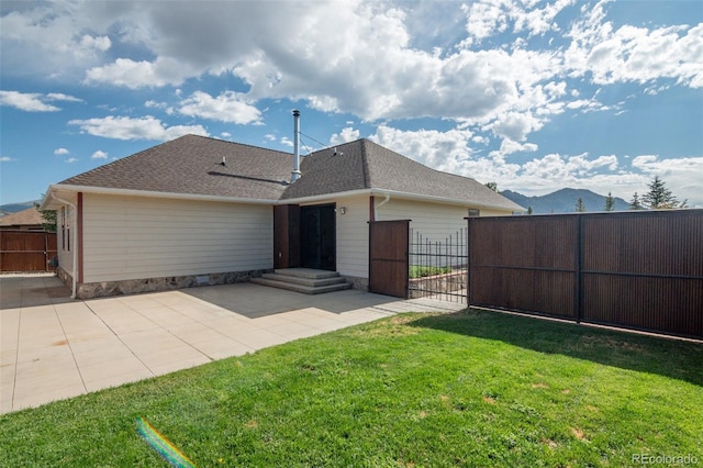 130 Windwalker Rd, Buena Vista, CO 81211 - rear view of property with a patio area, a gate, and roof with shingles