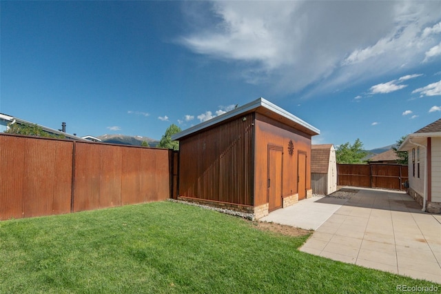 130 Windwalker Rd, Buena Vista, CO 81211 - fenced backyard with a patio and an outdoor structure