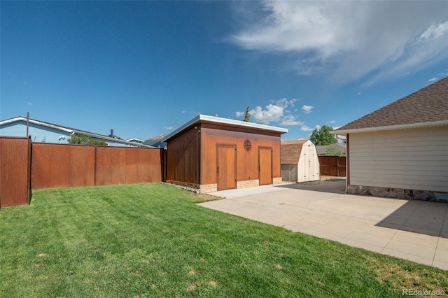 130 Windwalker Rd, Buena Vista, CO 81211 - fenced backyard featuring a storage unit and a patio