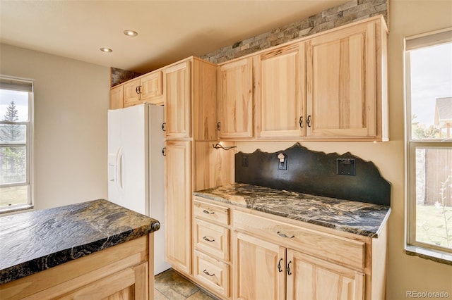 130 Windwalker Rd, Buena Vista, CO 81211 - kitchen with light brown cabinetry, white fridge with ice dispenser, dark stone counters, and recessed lighting