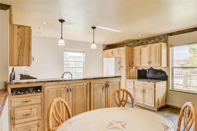130 Windwalker Rd, Buena Vista, CO 81211 - kitchen featuring light brown cabinetry, freestanding refrigerator, hanging light fixtures, tile counters, and recessed lighting