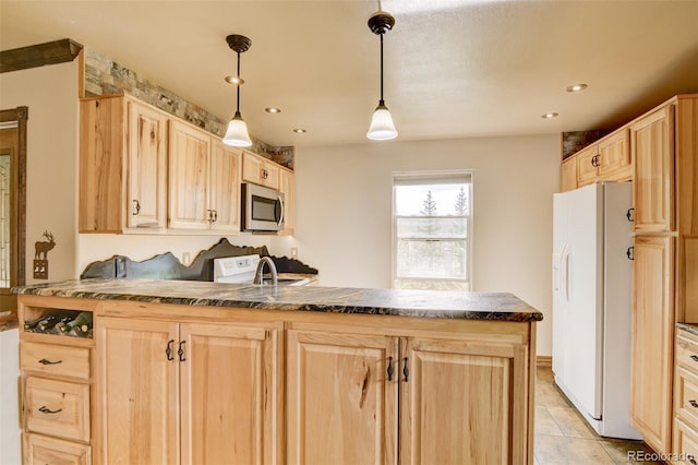 130 Windwalker Rd, Buena Vista, CO 81211 - kitchen featuring light brown cabinets, white fridge with ice dispenser, stainless steel microwave, dark countertops, and recessed lighting