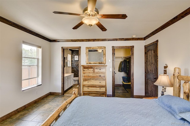 130 Windwalker Rd, Buena Vista, CO 81211 - bedroom featuring ensuite bathroom, a walk in closet, crown molding, ceiling fan, and stone finish flooring