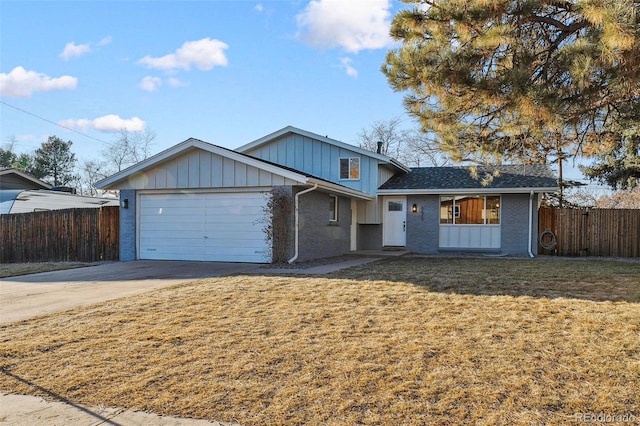 view of front of home featuring a garage and a front lawn