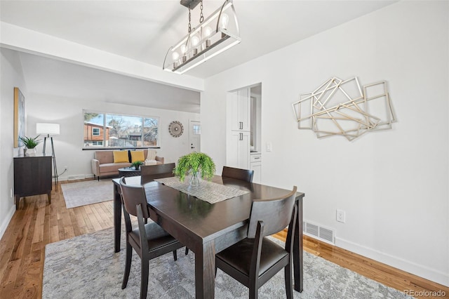 dining room with hardwood / wood-style floors