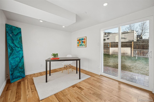 office with light wood-type flooring