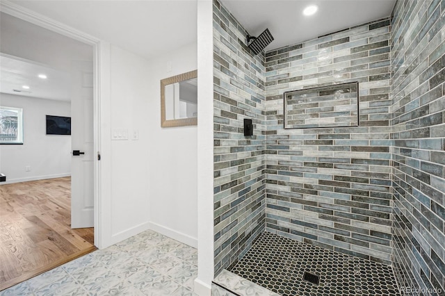 bathroom with a tile shower