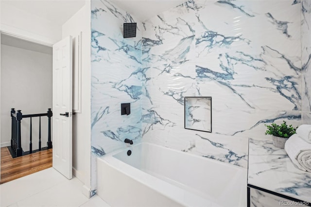 bathroom featuring tiled shower / bath combo