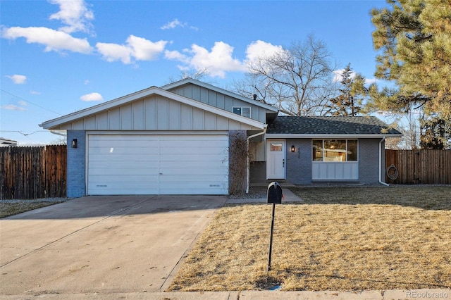 view of front of home with a garage and a front yard