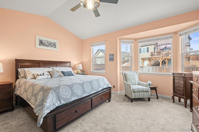 bedroom with vaulted ceiling, baseboards, carpet floors, and ceiling fan