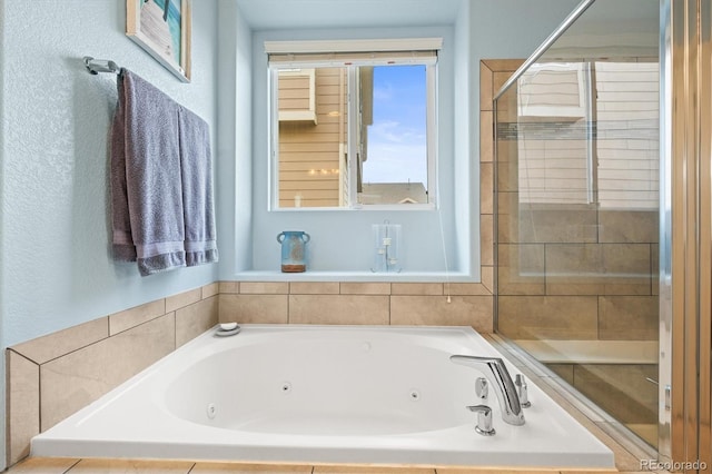 full bathroom featuring a stall shower and a whirlpool tub