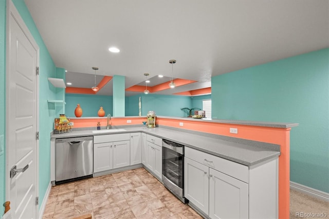 kitchen featuring beverage cooler, a sink, white cabinets, baseboards, and dishwasher