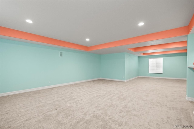 below grade area with carpet flooring, recessed lighting, and baseboards