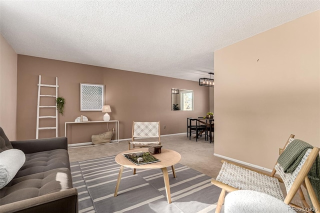 carpeted living room with a textured ceiling