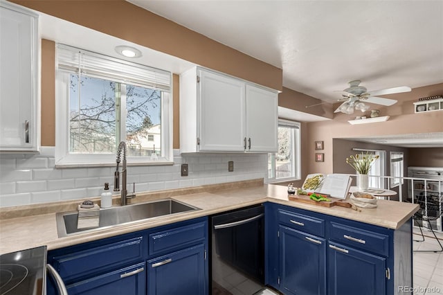 kitchen featuring blue cabinets, black dishwasher, sink, and white cabinets