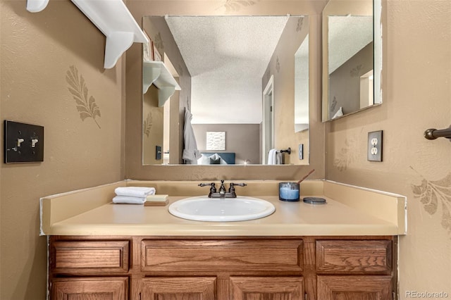 bathroom featuring vanity and a textured ceiling