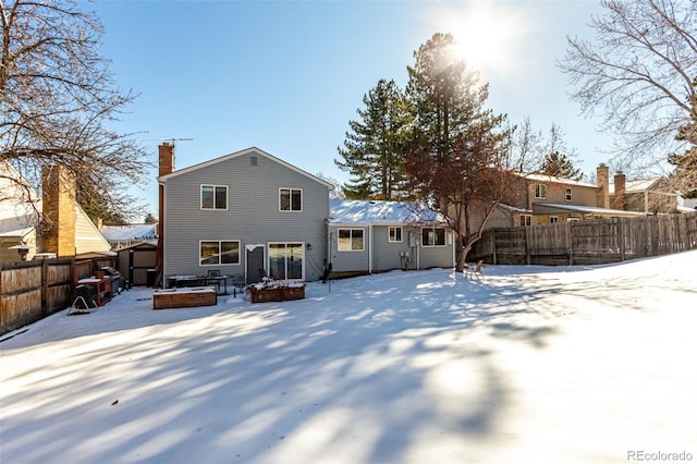 view of snow covered property