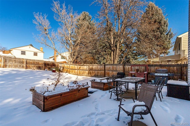 view of yard layered in snow