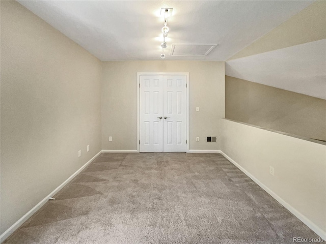 interior space with baseboards, visible vents, and carpet flooring