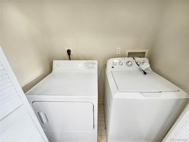 laundry room featuring laundry area and washing machine and clothes dryer