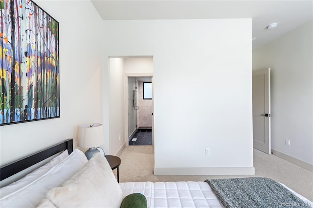 bedroom featuring carpet floors and baseboards