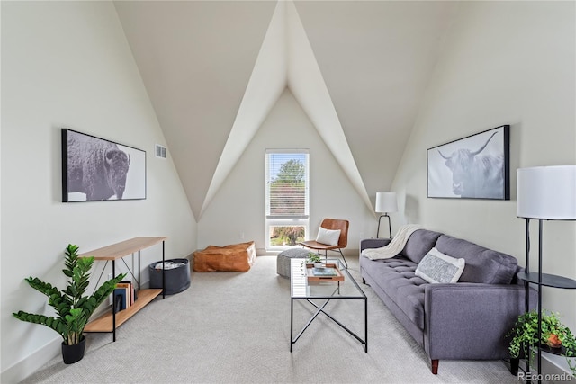 carpeted living room with vaulted ceiling