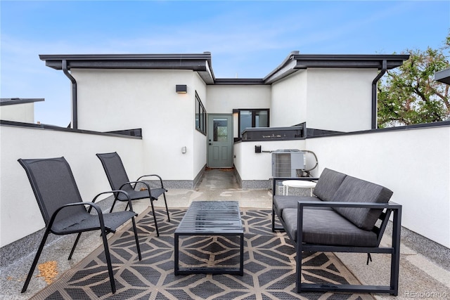 view of patio featuring cooling unit and an outdoor hangout area
