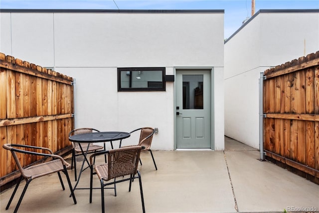 view of patio / terrace featuring fence and outdoor dining area