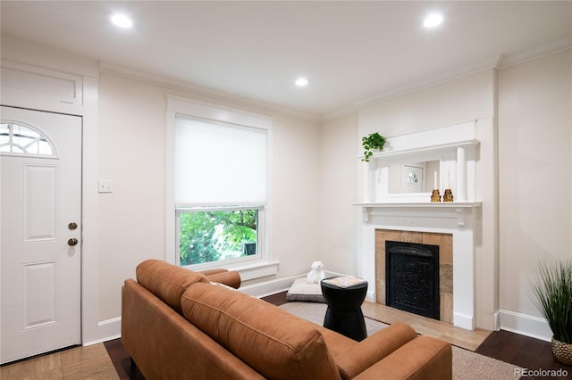 3071 W 38th Ave, Denver, CO 80211 - living room featuring crown molding, baseboards, a tiled fireplace, recessed lighting, and wood finished floors