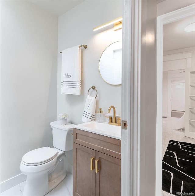 3071 W 38th Ave, Denver, CO 80211 - bathroom featuring vanity, toilet, and baseboards