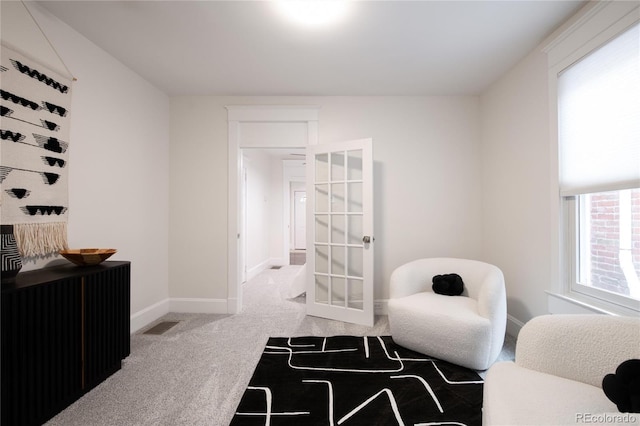 3071 W 38th Ave, Denver, CO 80211 - living area featuring carpet floors, baseboards, and french doors