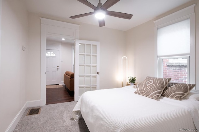 3071 W 38th Ave, Denver, CO 80211 - carpeted bedroom with multiple windows, baseboards, and ceiling fan