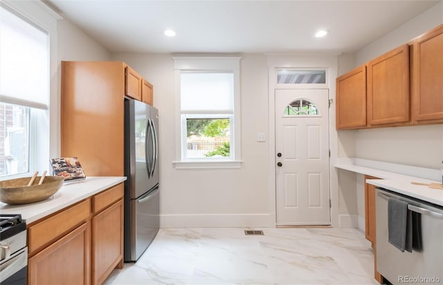 3071 W 38th Ave, Denver, CO 80211 - kitchen with appliances with stainless steel finishes, light countertops, light marble finish floors, recessed lighting, and baseboards