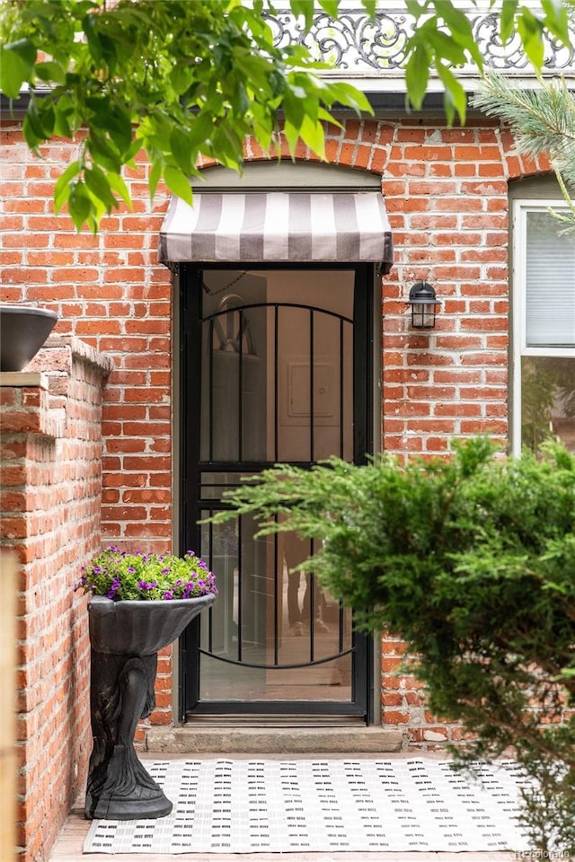 3071 W 38th Ave, Denver, CO 80211 - doorway to property featuring brick siding