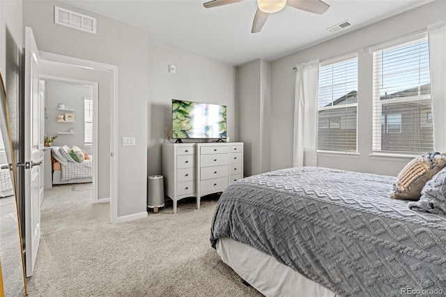 bedroom featuring ceiling fan, light carpet, and stainless steel refrigerator