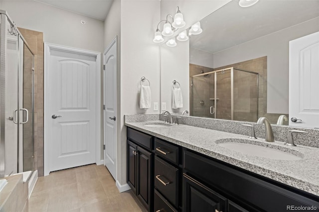 bathroom featuring vanity, tile patterned floors, and an enclosed shower