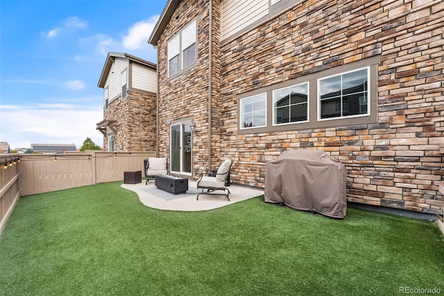 back of house featuring a patio area and a yard