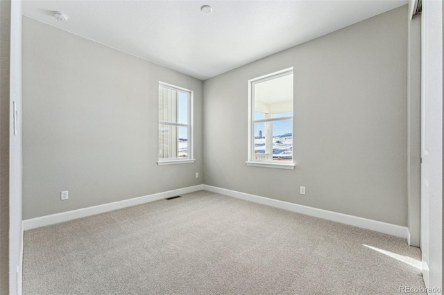 unfurnished room with carpet floors