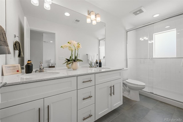 1337 N Alton St, Aurora, CO 80010 - full bathroom with double vanity, a shower stall, toilet, and tile patterned floors