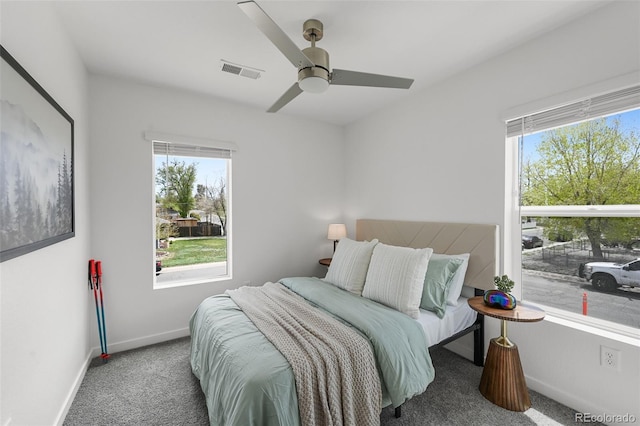 1337 N Alton St, Aurora, CO 80010 - bedroom with carpet flooring, multiple windows, baseboards, and ceiling fan