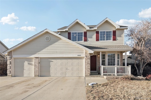 view of front property featuring a garage and a porch