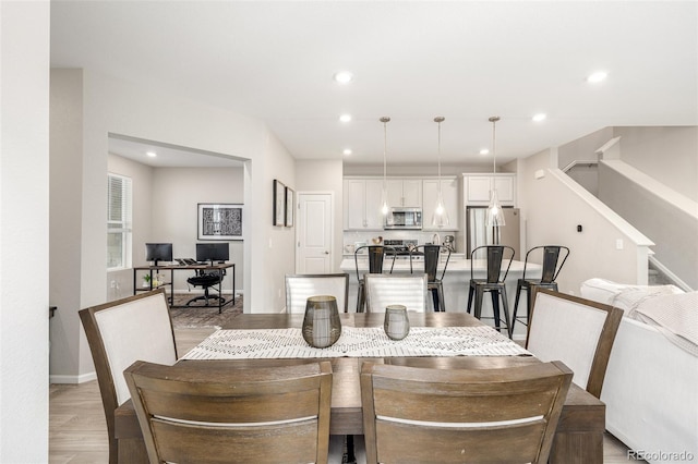 dining space featuring light hardwood / wood-style flooring