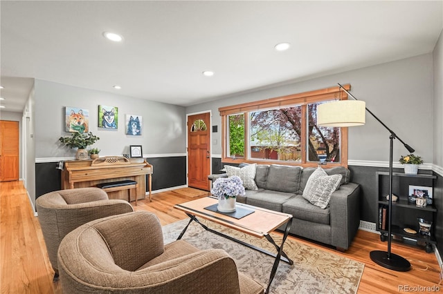 living area with recessed lighting, baseboards, and light wood-style floors