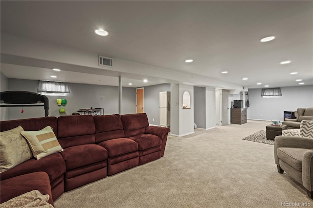 living area featuring light colored carpet, visible vents, and recessed lighting