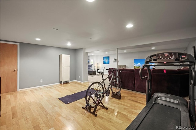 workout room with light wood-style flooring, baseboards, and recessed lighting