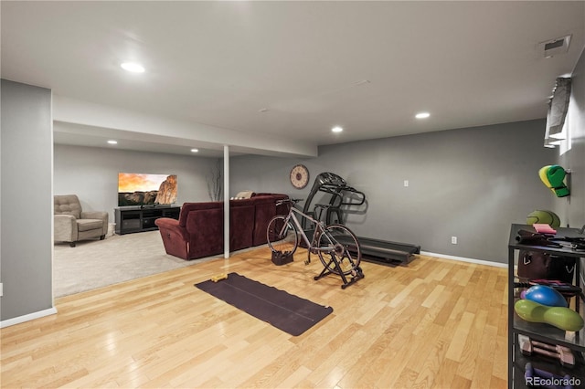 workout room featuring visible vents, wood finished floors, baseboards, and recessed lighting