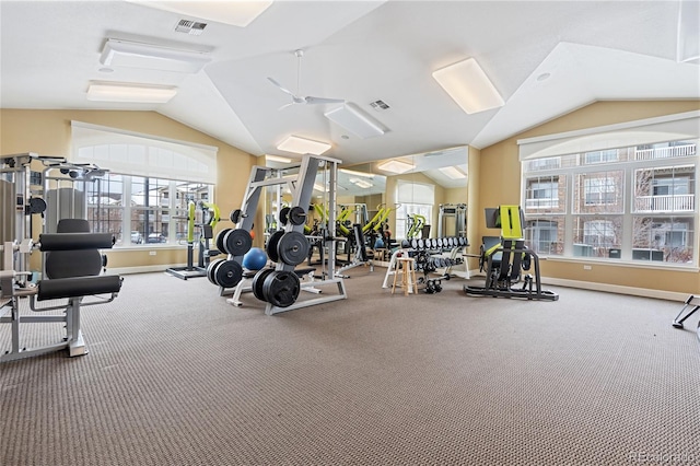 exercise room featuring carpet and vaulted ceiling