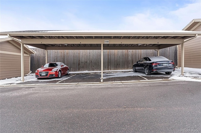 view of vehicle parking with a carport